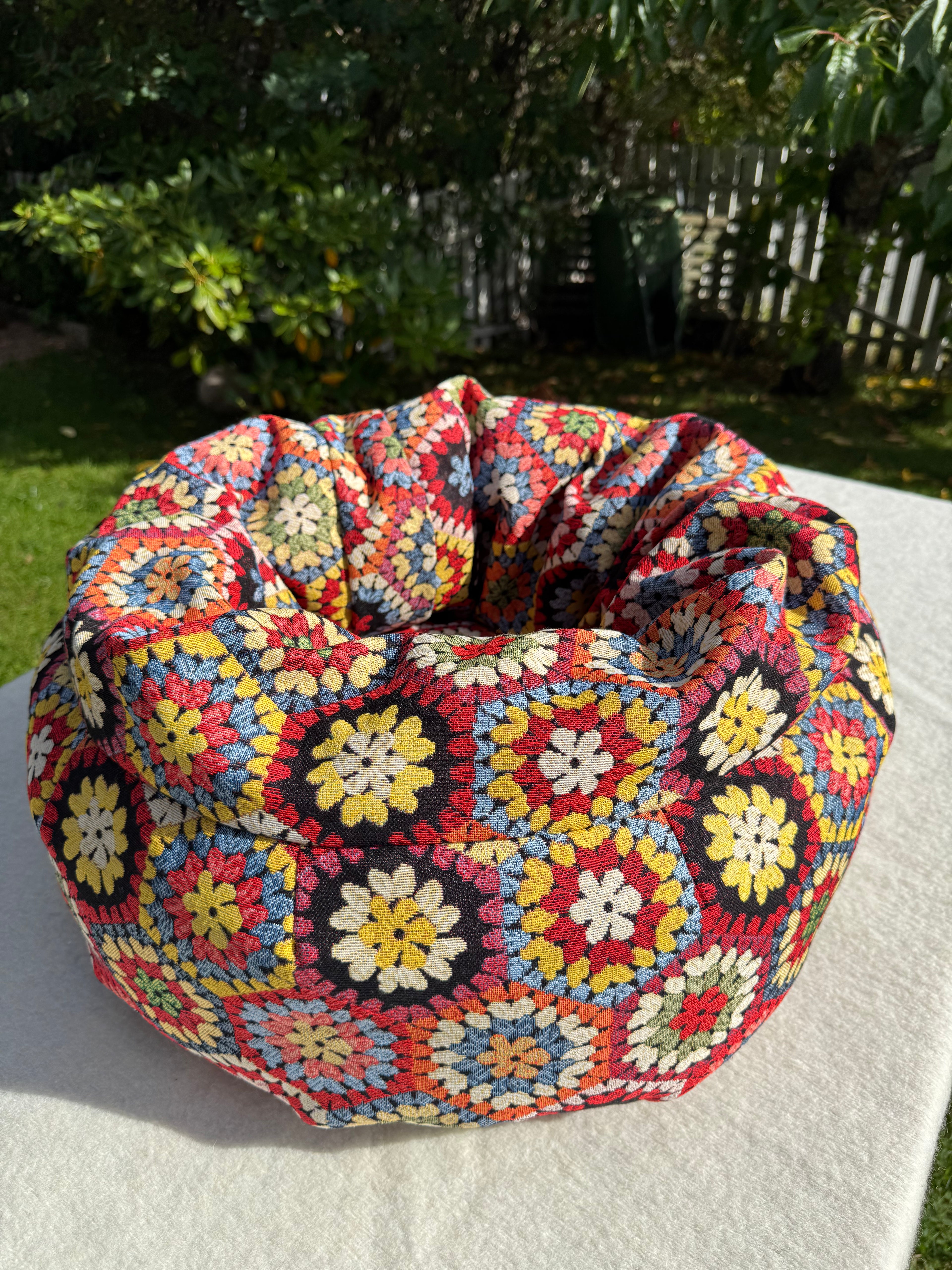 ndmade BOHO cat bed with colorful tapestry fabric, filled with natural sheep’s wool.