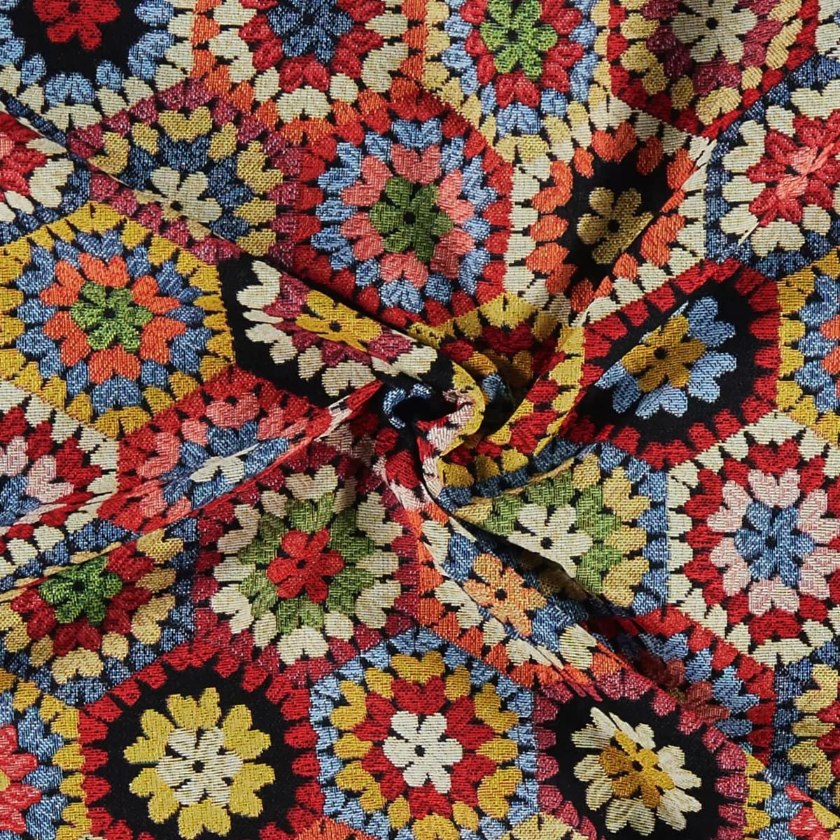 Multicolored crochet patterned fabric with a black background